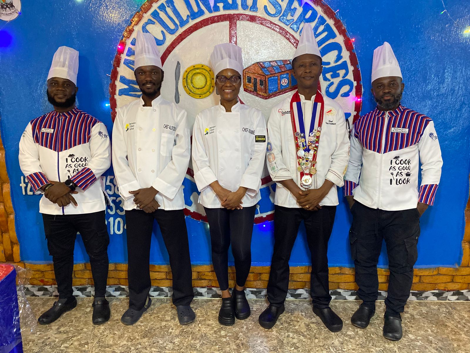 Chef instructors and judges lined up at the culinary event