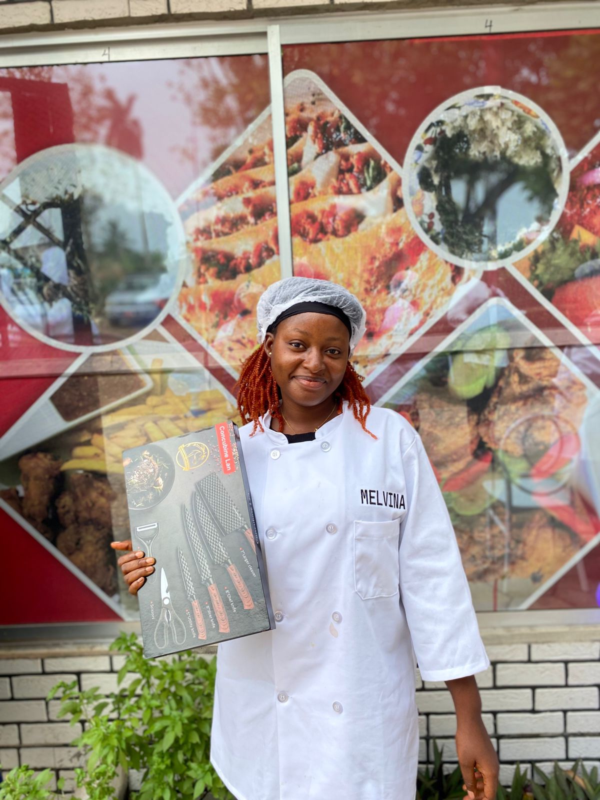 Chef Melvina holding her new knife set